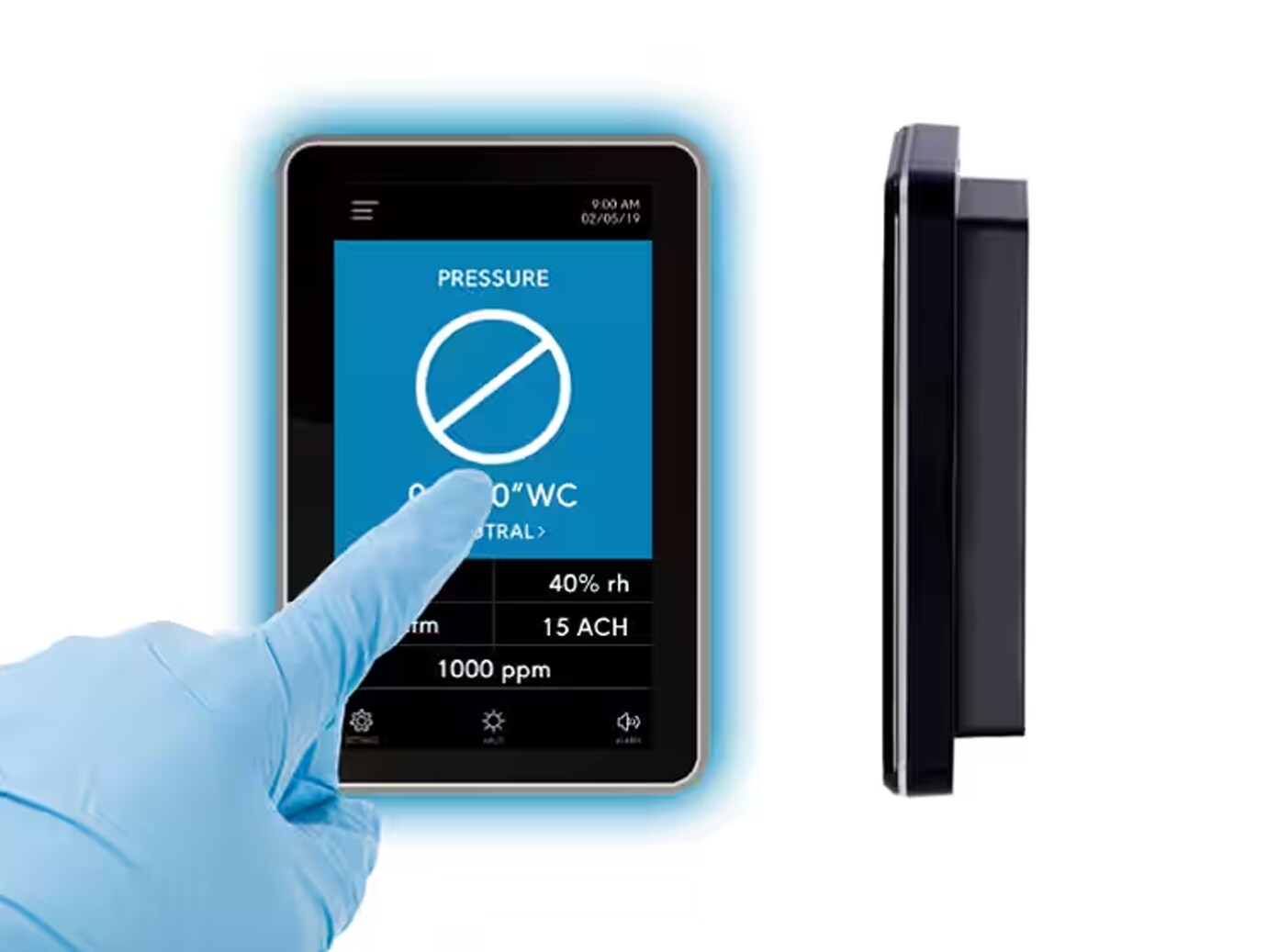 Gloved hand setting the FMS 2000M Device