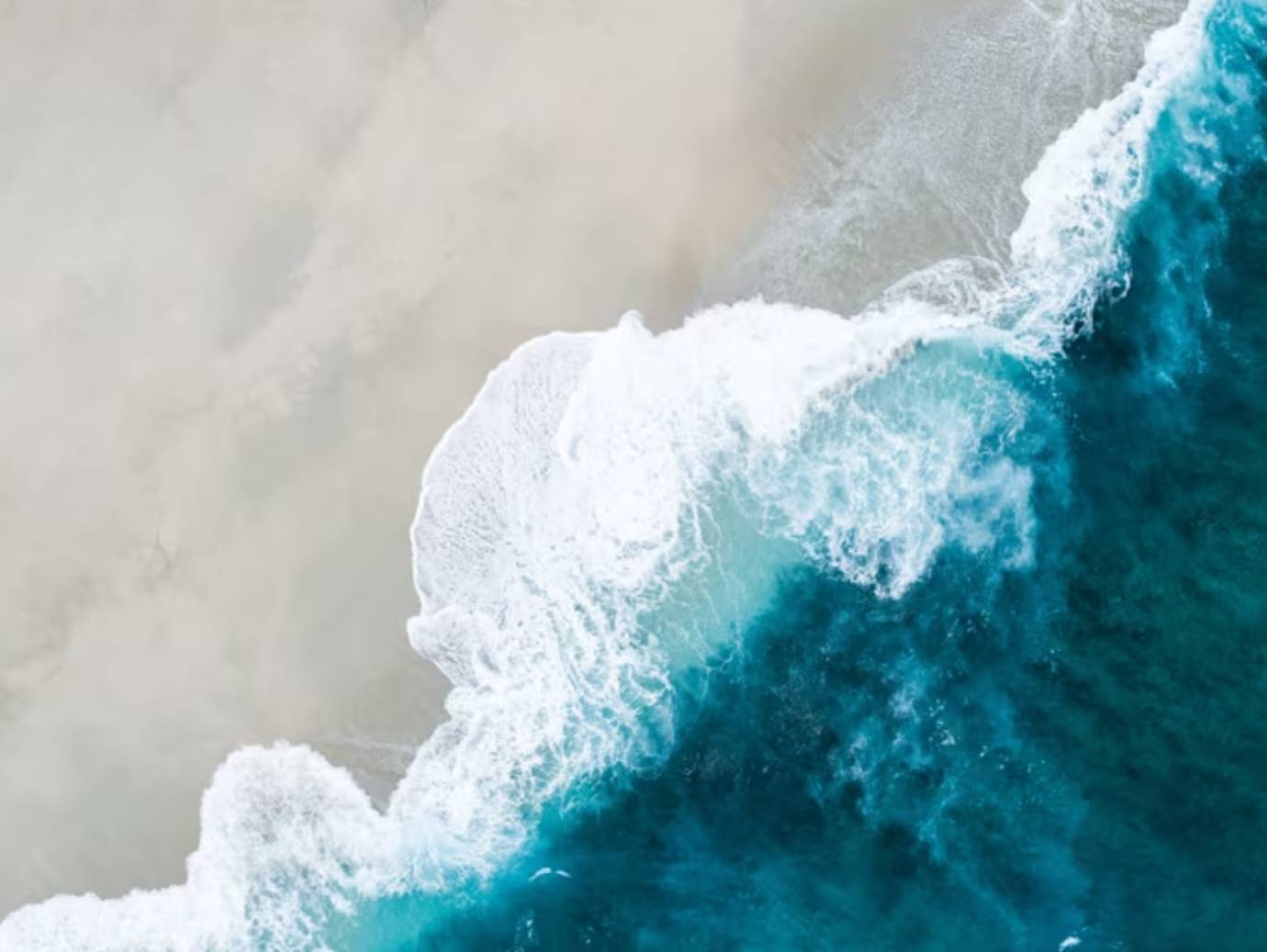 Aerial view of sea waves at a beach