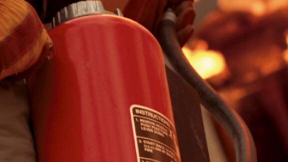 firefighter with extinguisher closeup