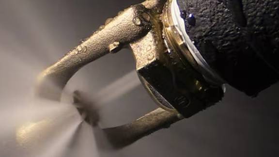 Close-up of a fire sprinkler in operation