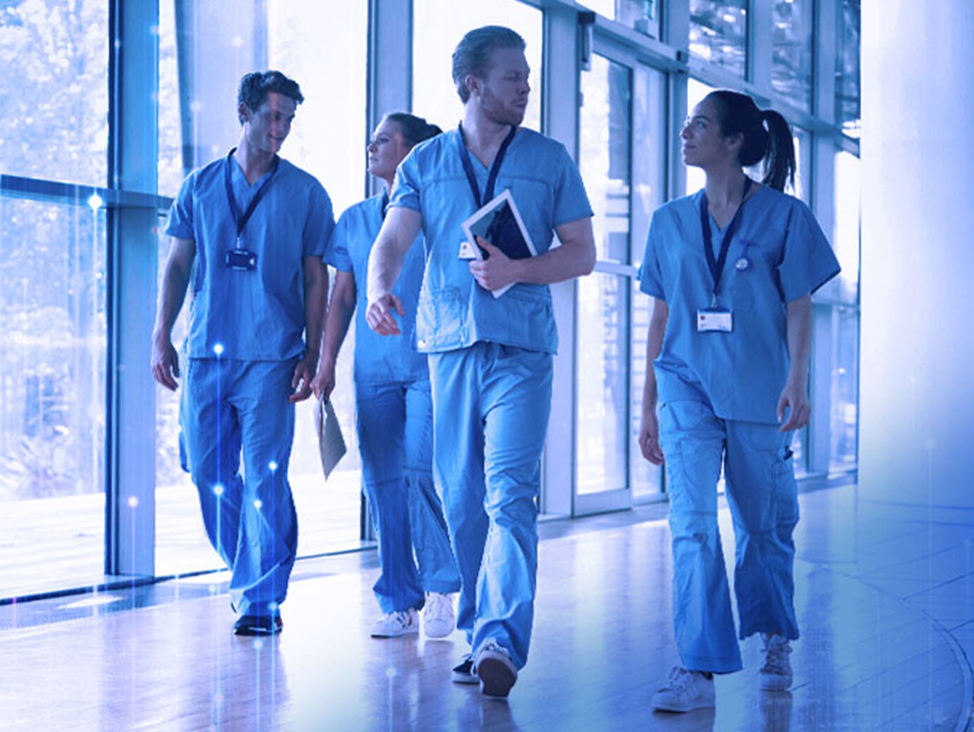 healthcare workers walking in scrubs