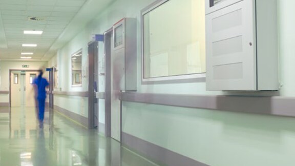 nurse walking in hospital corridor