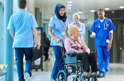 wheelchair with doctors in background