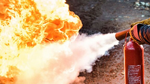 fire extinguisher putting out fire