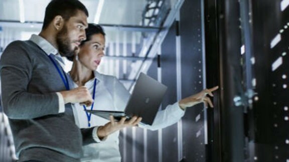 man woman laptop data centre