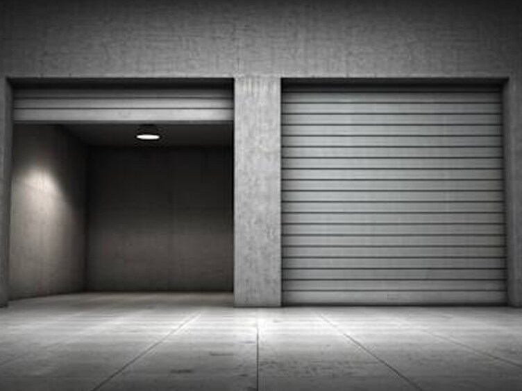 Greyscale shot of an open and a closed storage unit