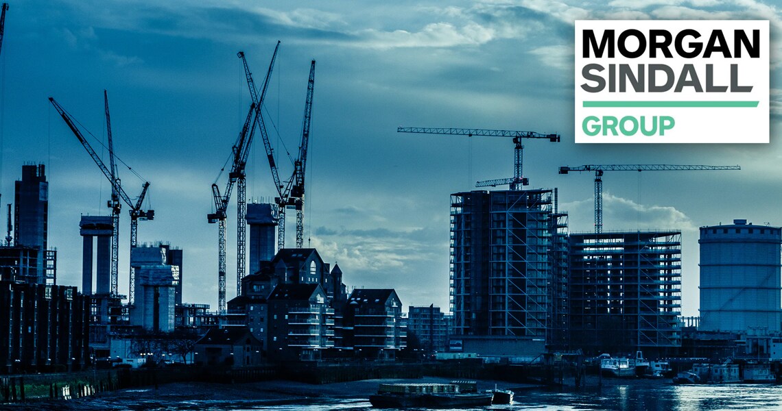 A row of buildings under construction, with the Morgan Sindall logo on the top right corner