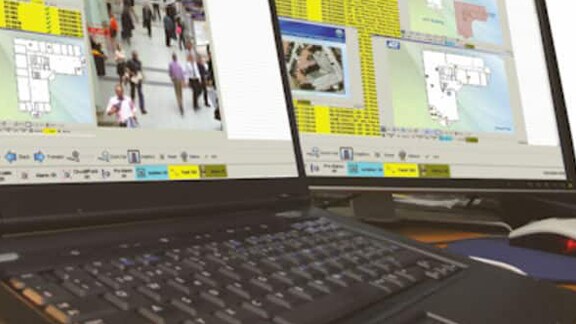 Two computer screens displaying fire detection networks