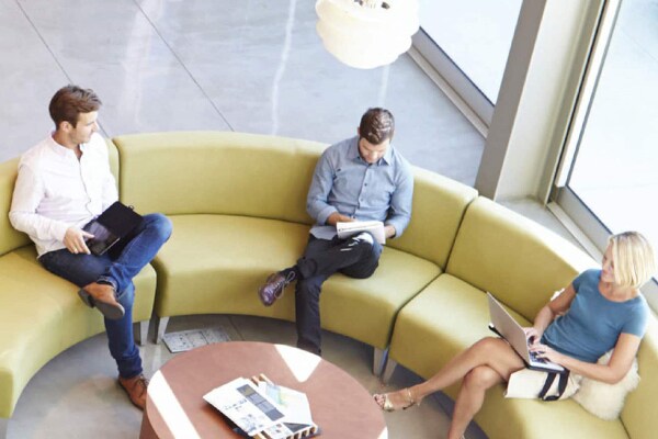 People sitting in office lobby