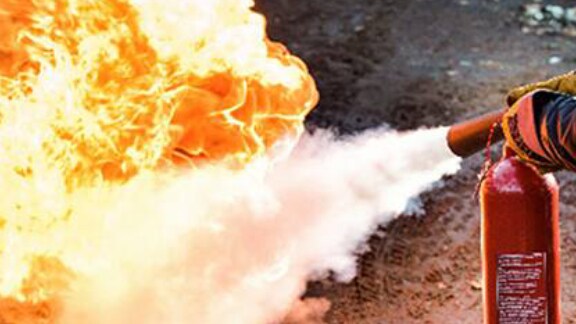 fire being put out by fire extinguisher