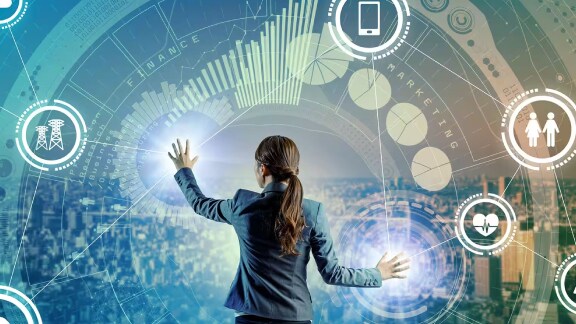 woman working on a user interface with graphics depicting digital communication