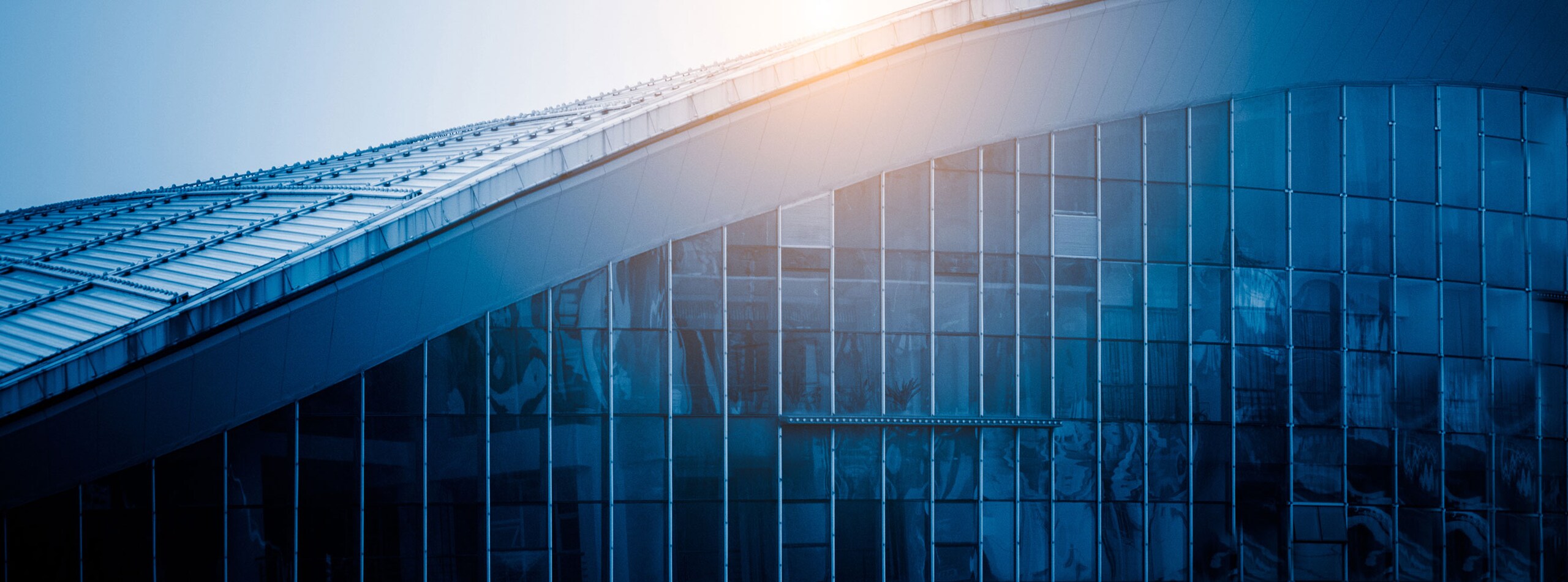 Exterior of a curved commercial building at daytime