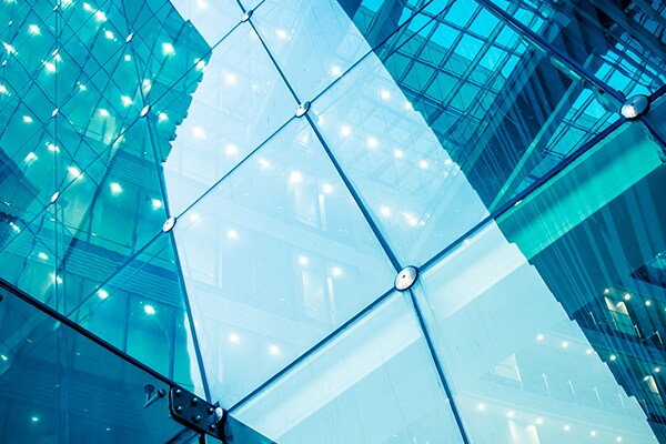 Close-up of glass windows of a corporate building