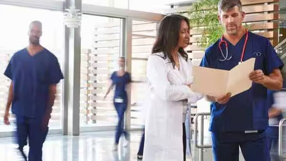 Doctors checking report