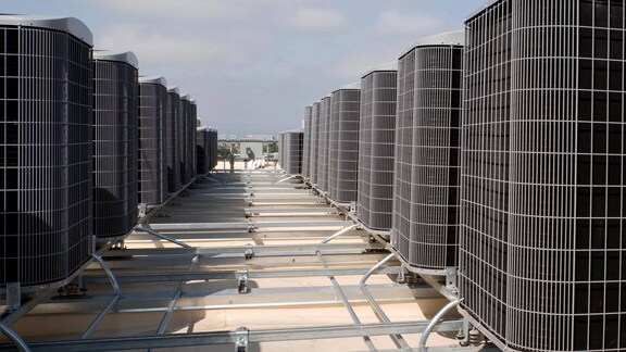 Outdoor units in a sequence on a rooftop