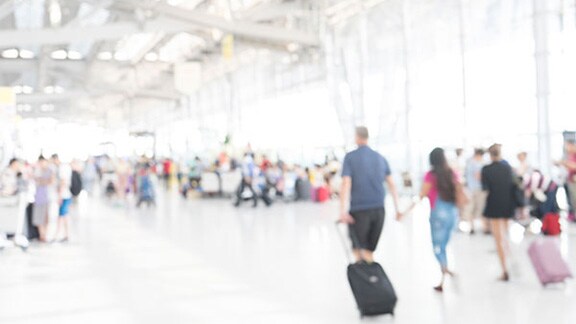Blurred shot of people walking at an airport