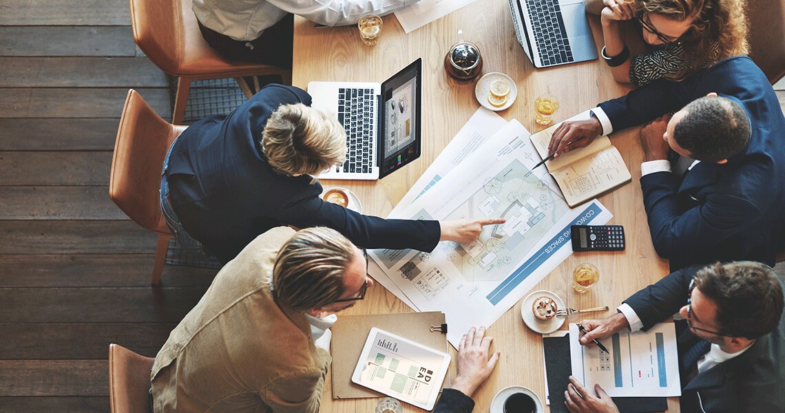 People having a discussion sitting at a conference table