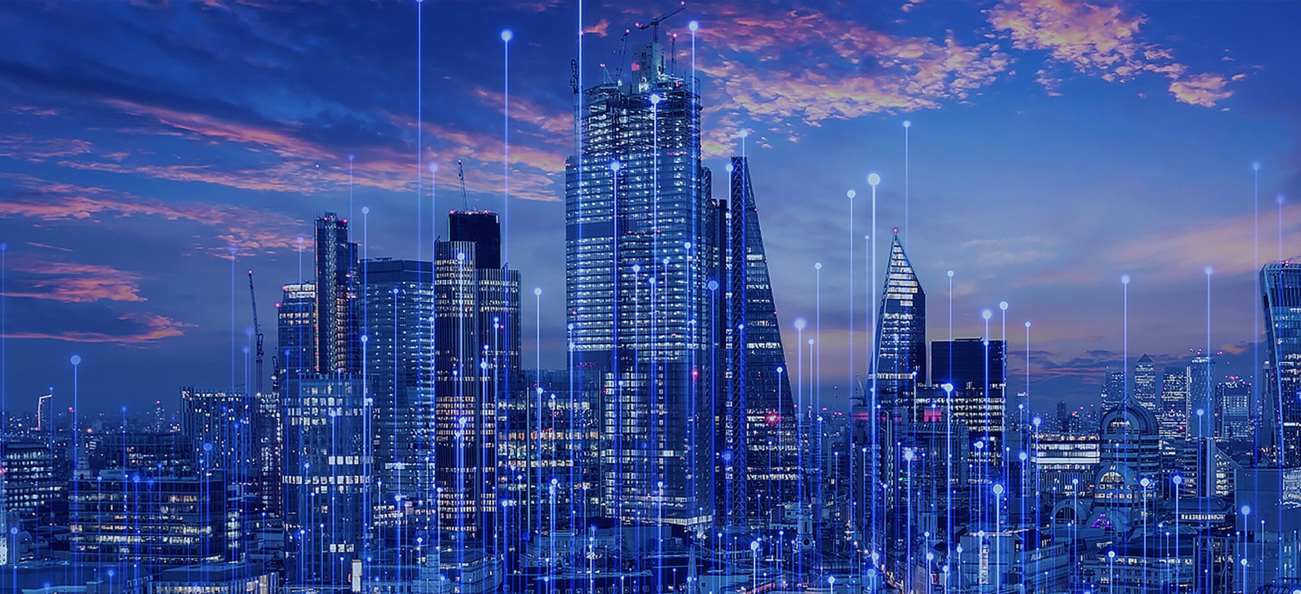 A city skyline at dusk with modern graphics
