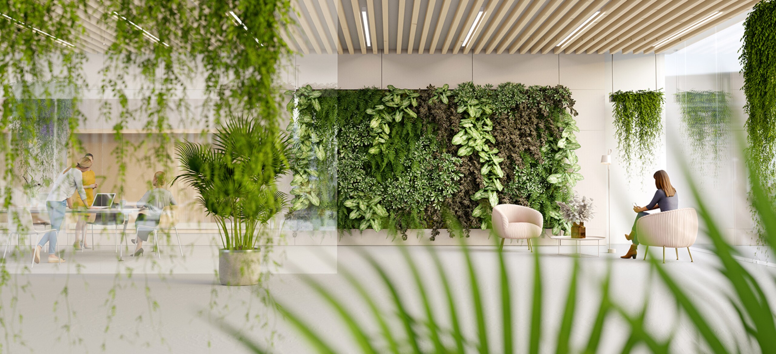 A woman sitting in a waiting room with a vertical garden