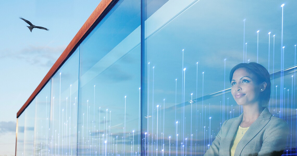 A woman looking out a window with a bird right outside with modern graphics