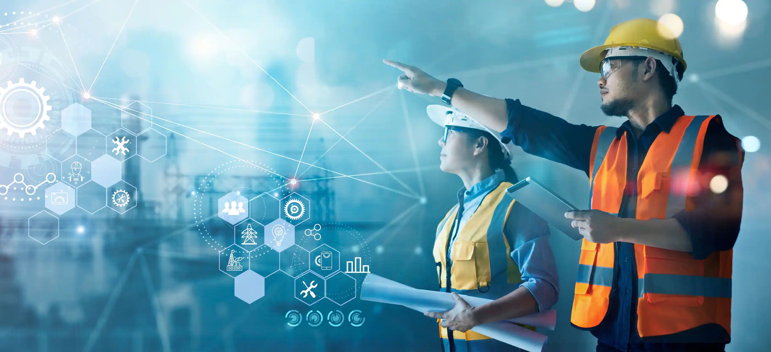 Two people in safety equipment with one pointing at something with graphics imposed on the image