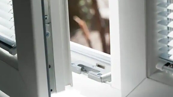 Close-up of a burglar alarm system installed in a window