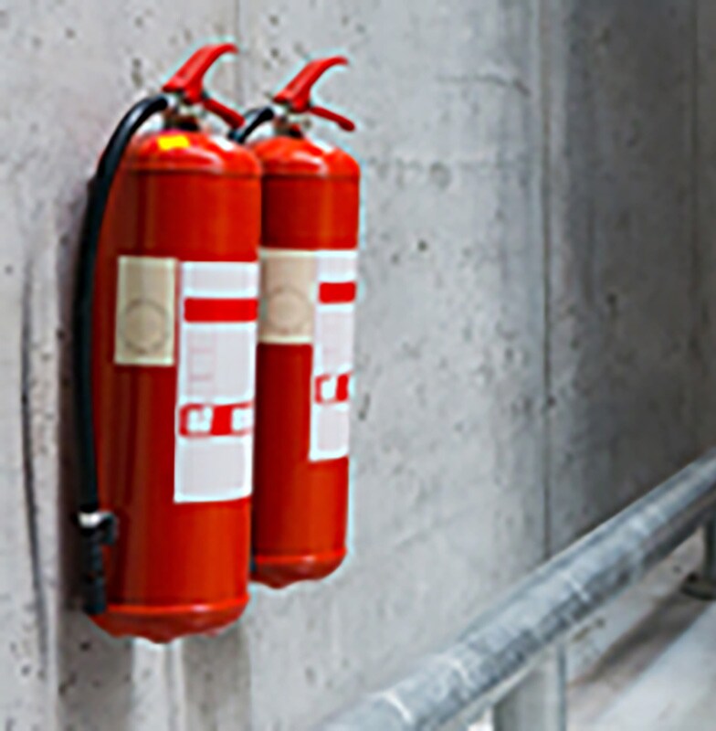 Fire extinguishers installed in a corridor