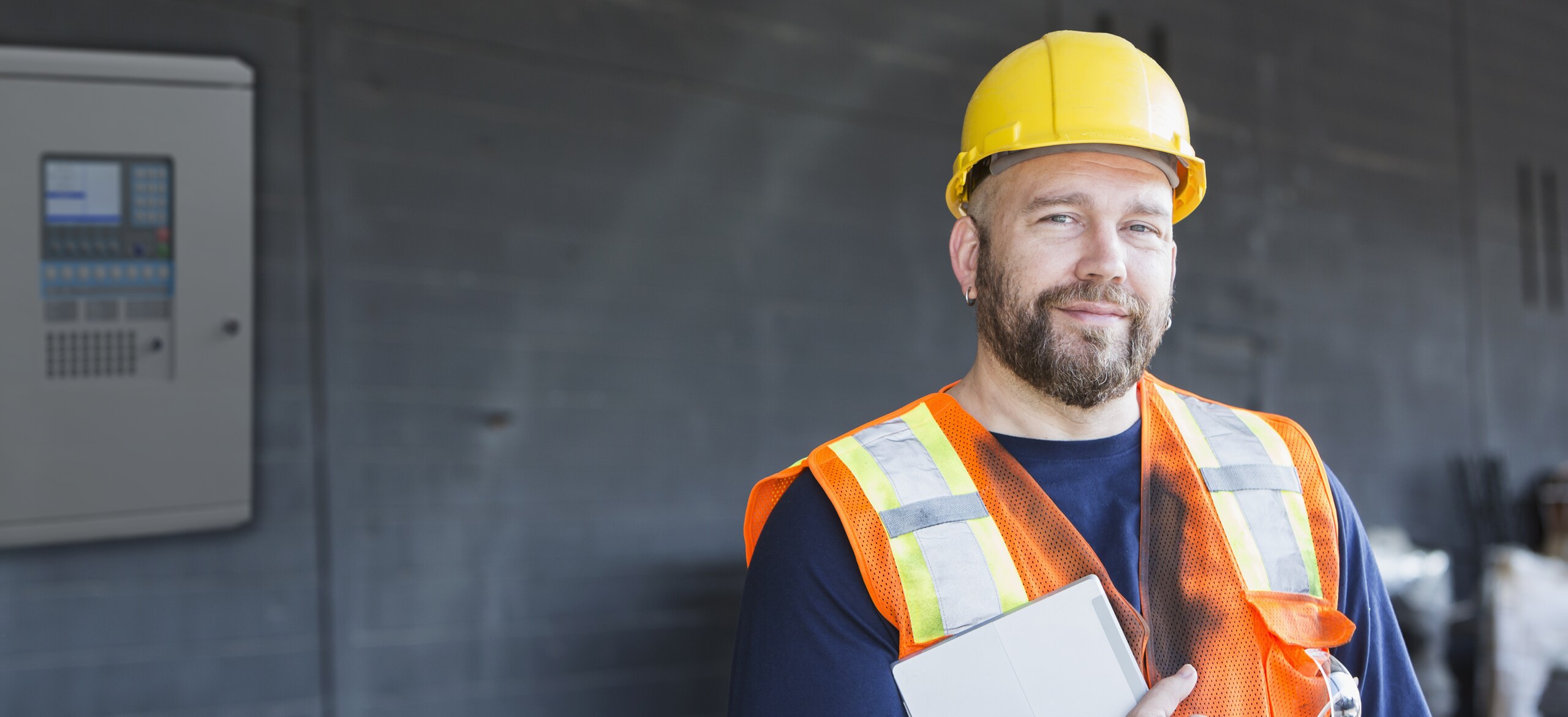 A man in safety equipment smiling