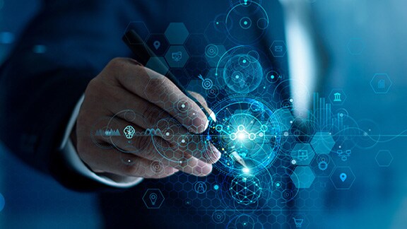 Close-up of a man using a pen against a smart screen