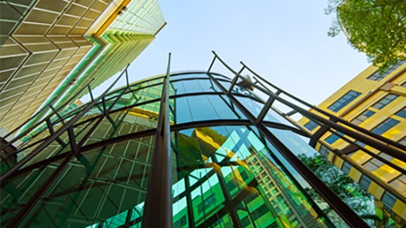 Low-angle shot of a modern building with glass exteriors