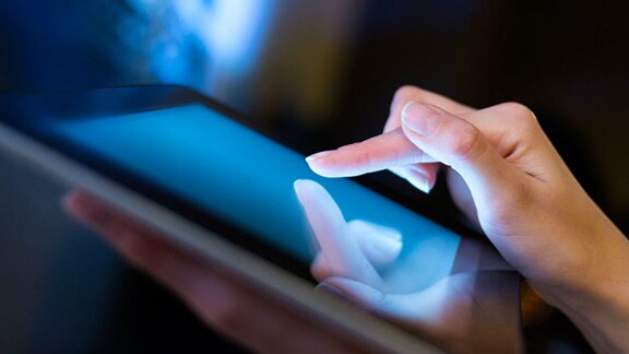 Close-up of a person using a tablet