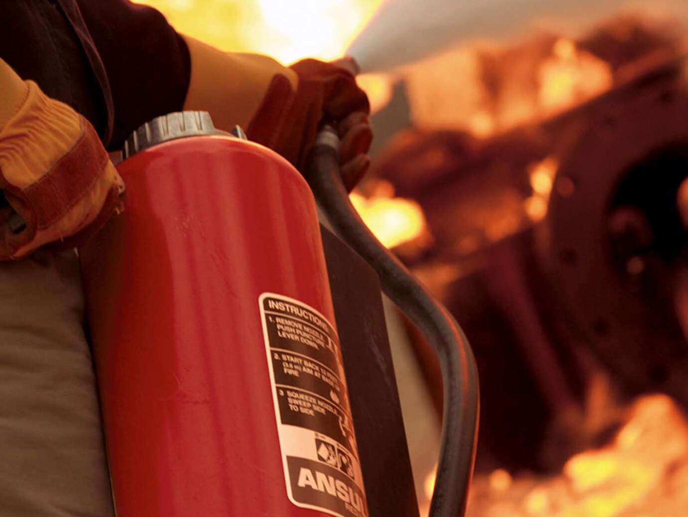 A fire extignuisher being used to put out fire