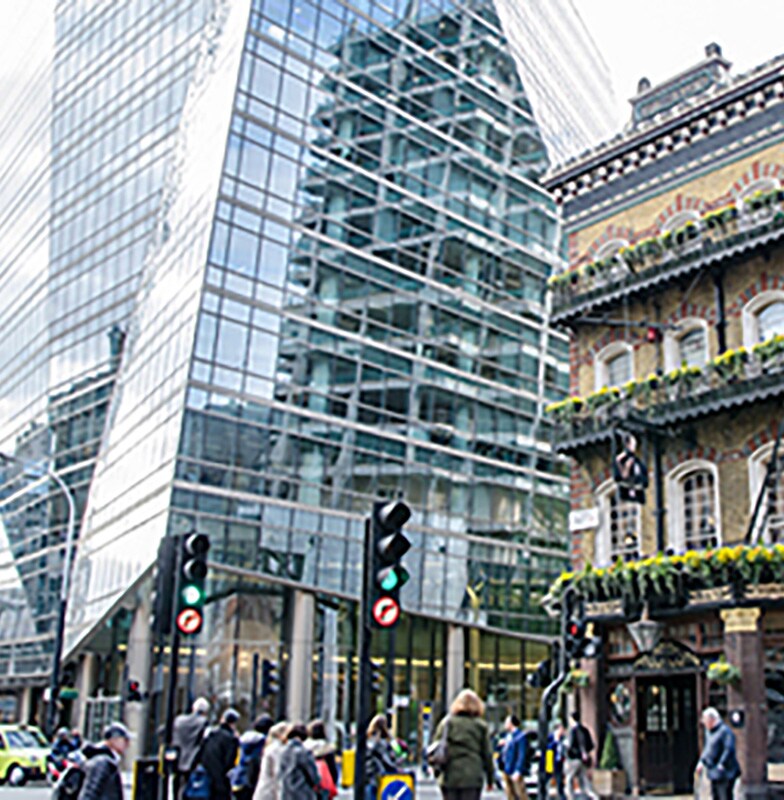 Street in front of old and modern buildings in London