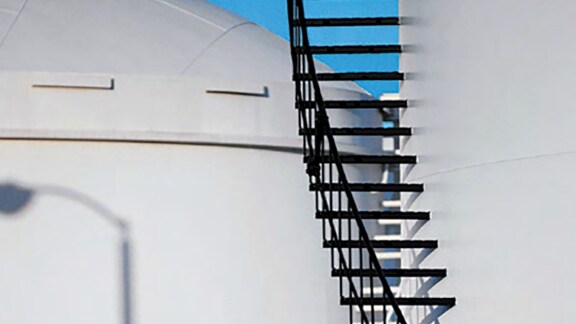 Close up industrial outdoor storage tanks.