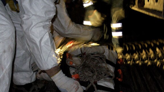 Workers preparing confined space equipment