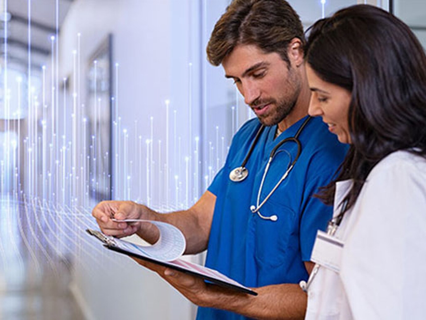 A male nurse showing a document to a female doctor
