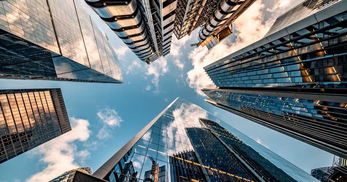 An upward shot of skyscrapers in daylight