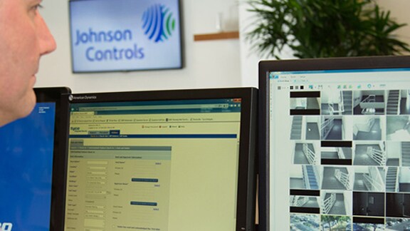 security officer watching surveillance footage