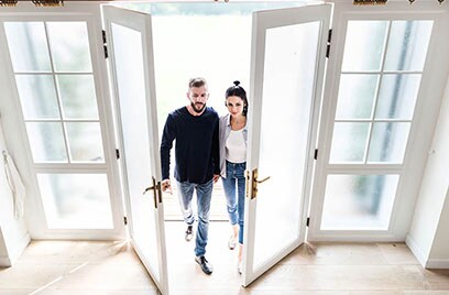 couple entering their home