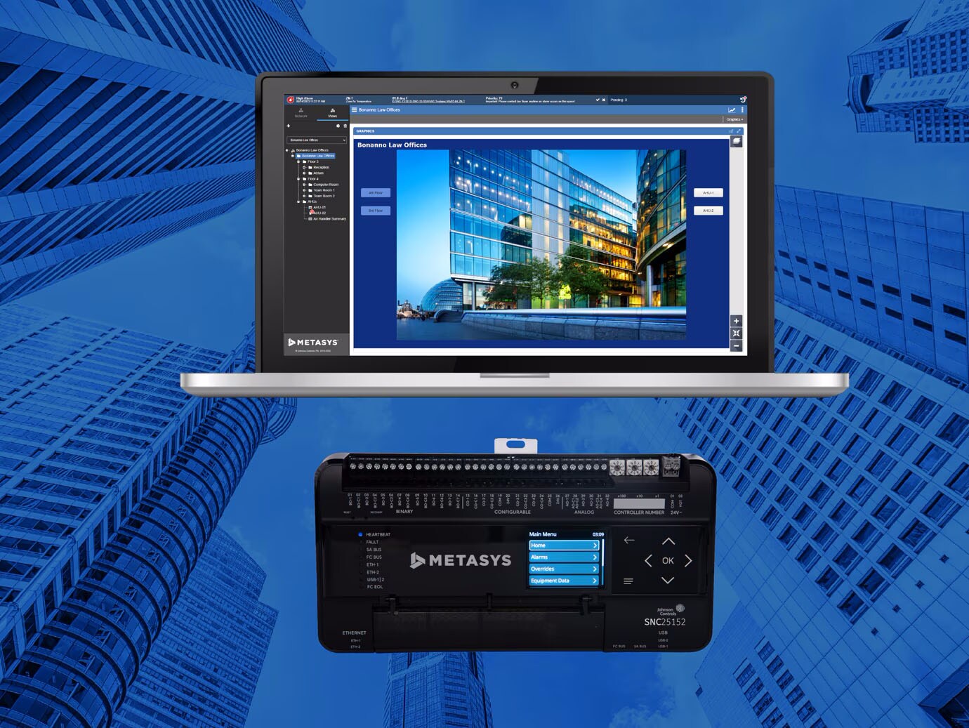 A laptop screen displaying the Metasys interface alongside a Metasys controller overlaid on an image of high-rise buildings