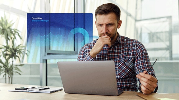 Man looking into laptop and thinking, with a blue OpenBlue poster overlaid in the center