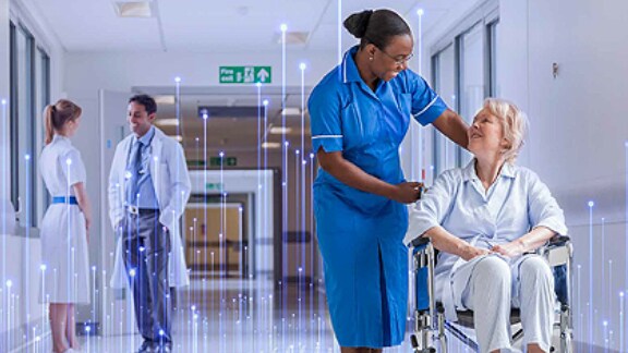 patient in wheelchair in hospital corridor