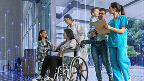 patient in wheelchair with family