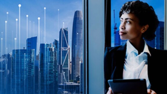 businesswomen near window in office