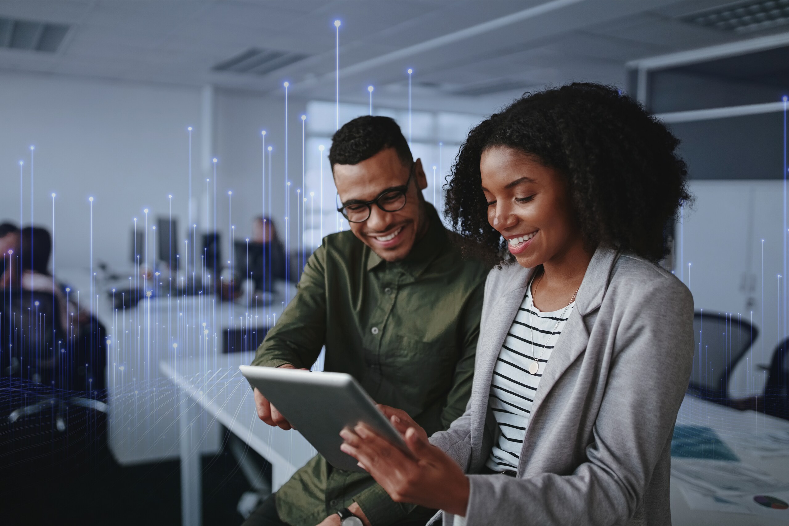 A man & women looking into tablet