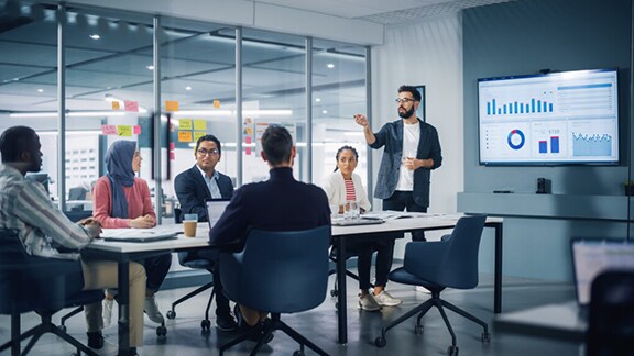 People discussing topic in conference room
