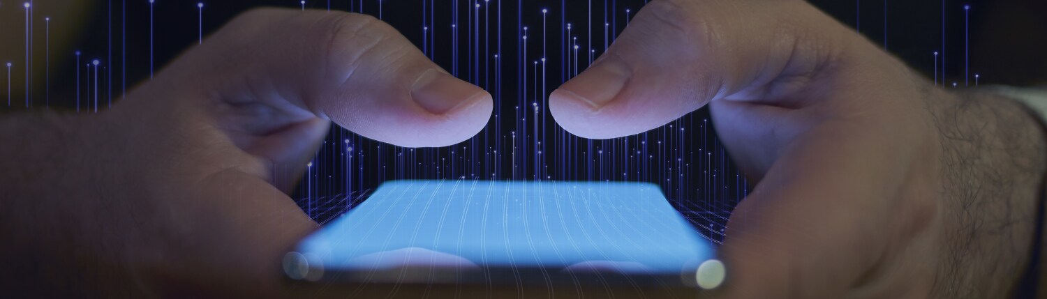 Close-up of hands holding a smartphone with graphic of transmission nodes overlaid in the background