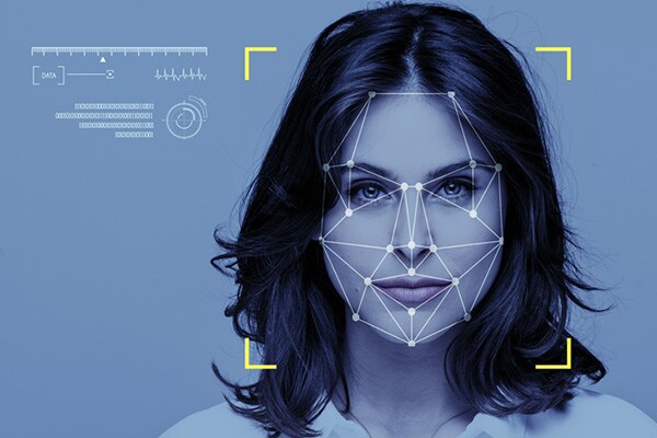 Close-up of a woman's face with an overlay of facial recognition graphics
