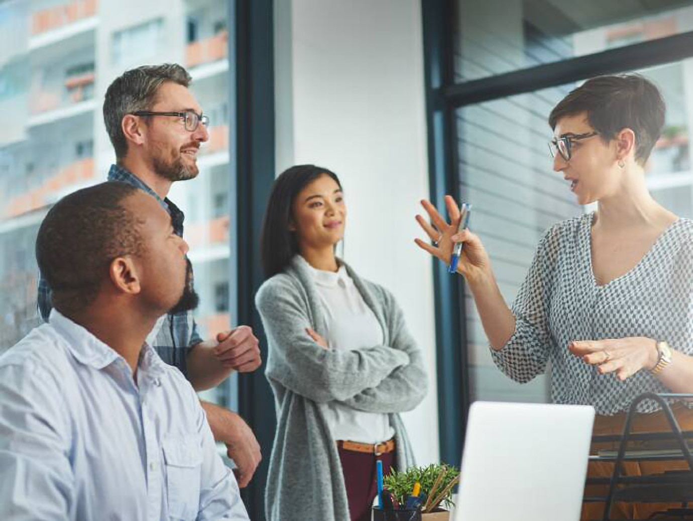 colleagues having a discussion in a modern office