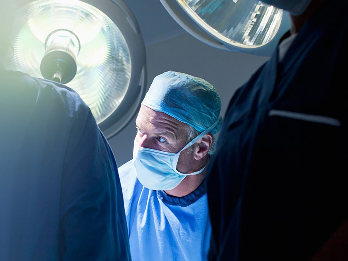 A surgeon in an operating theatre